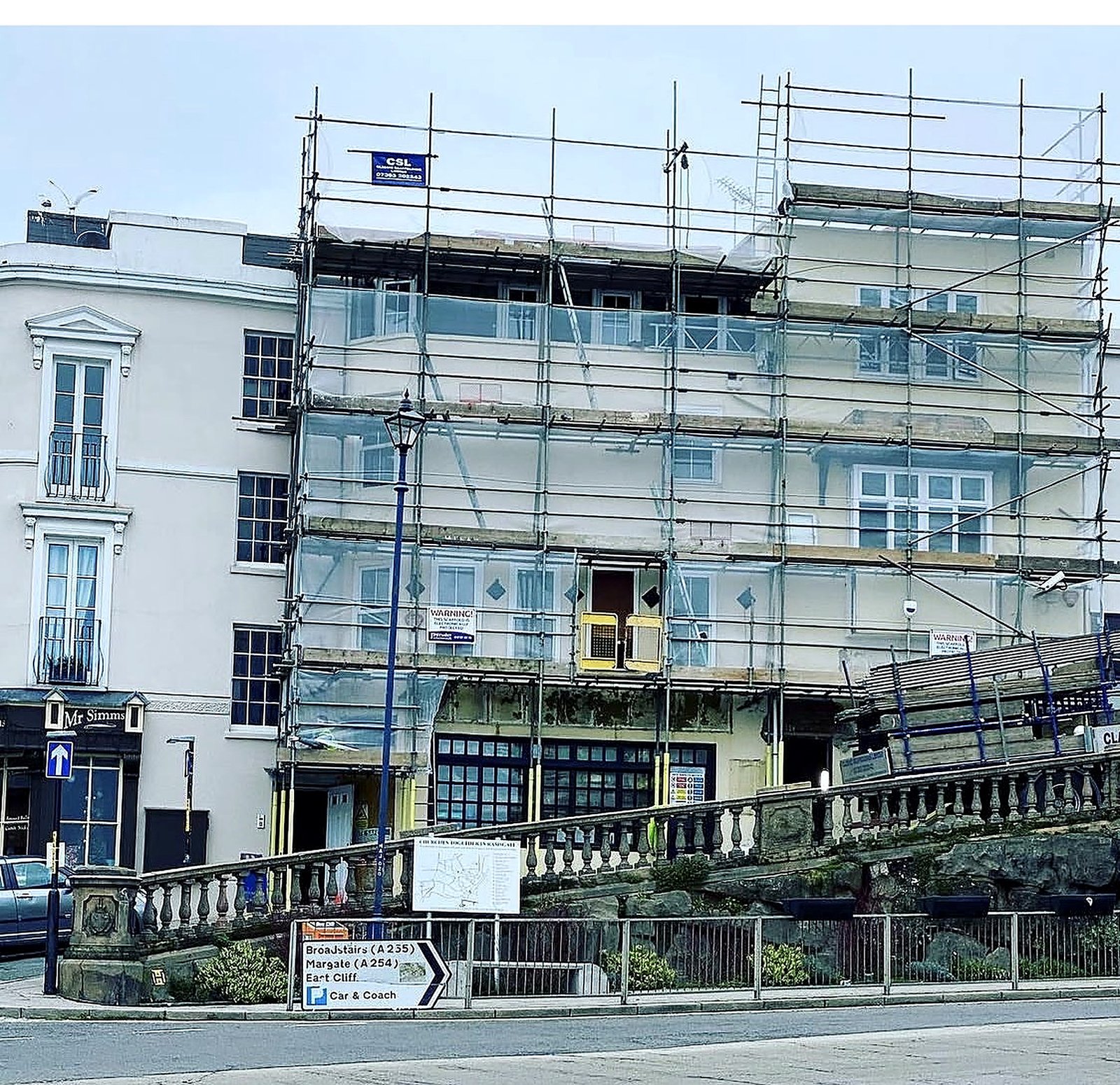 Facade scaffold across a white period terrace
